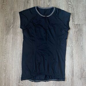 Lululemon Cycling Shirt black lined in gray has three back pockets quarter zip
